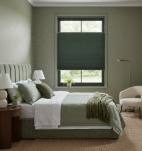 A green bedroom has top-down bottom-up-honeycomb shades.