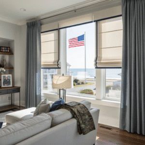 A home on a military base has roman shades up to show a US flag.